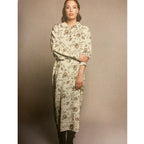 Knitted fabric 145cm - flowers on moss green background