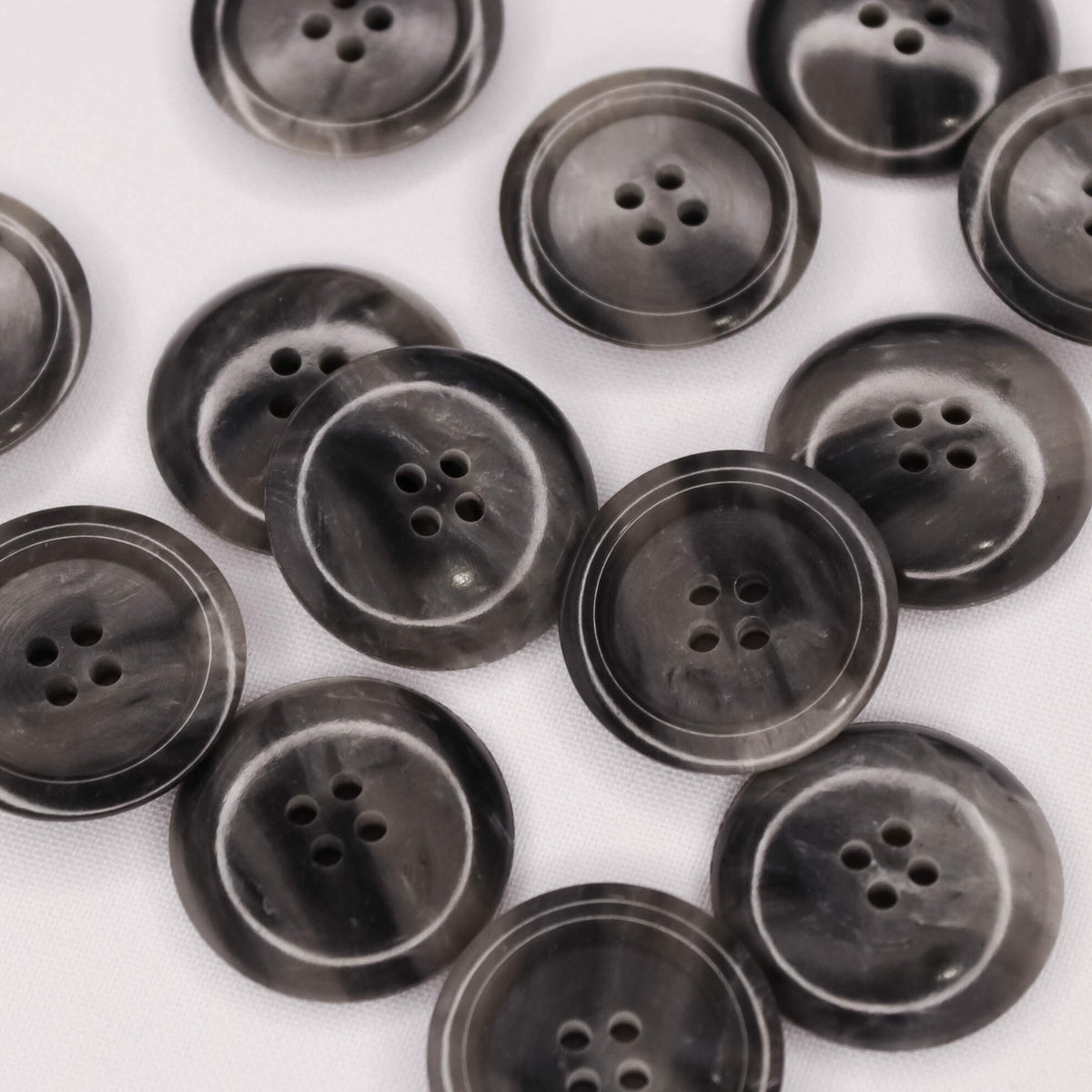 Plastmasas poga Ø28mm - pelēka, raiba