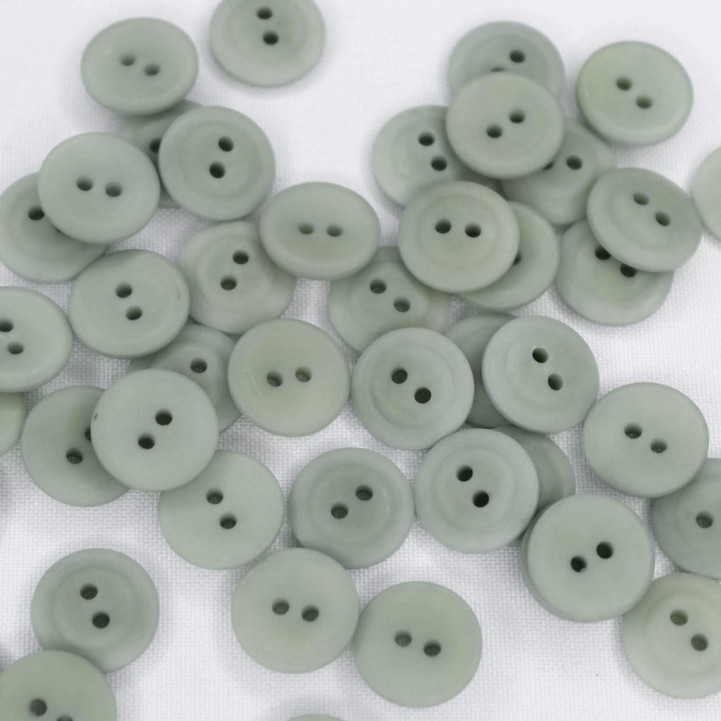 Plastmasas poga Ø15mm - dūmakaini zilzaļa