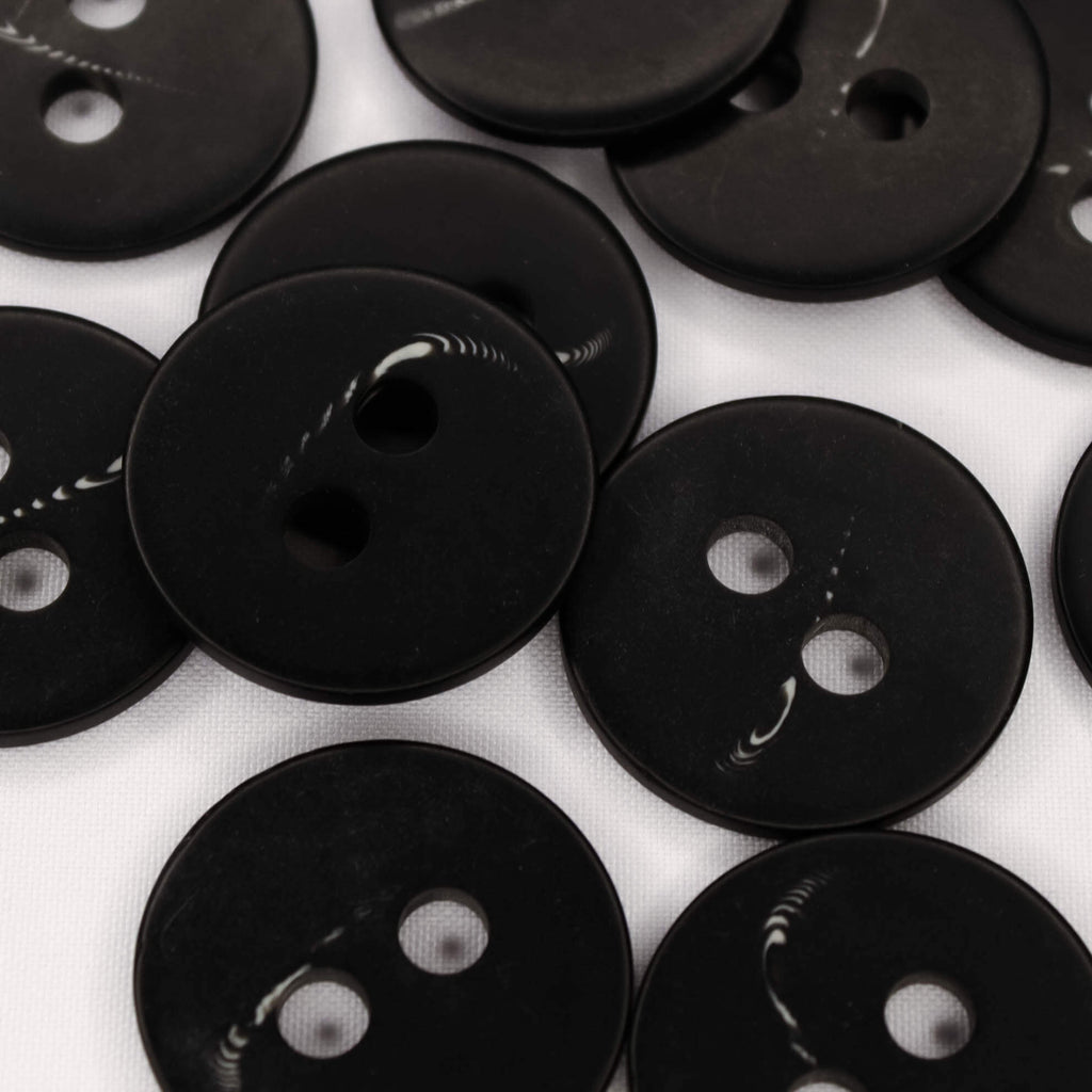 Plastmasas poga Ø38mm - melna ar rakstiņu