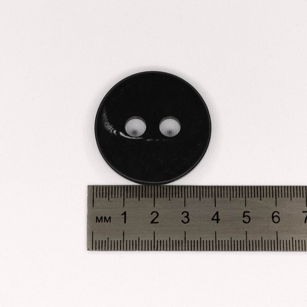 Plastmasas poga Ø38mm - melna ar rakstiņu