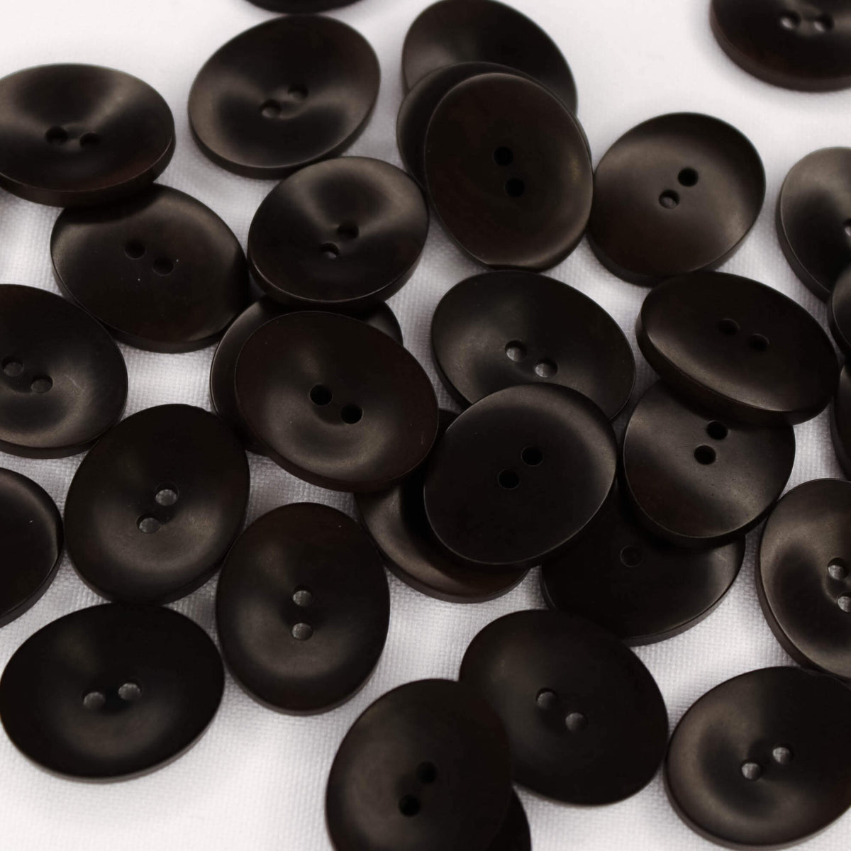 Plastmasas poga 18x23mm - tumši brūna