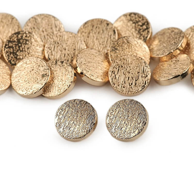 Metal buttons on the leg - gold